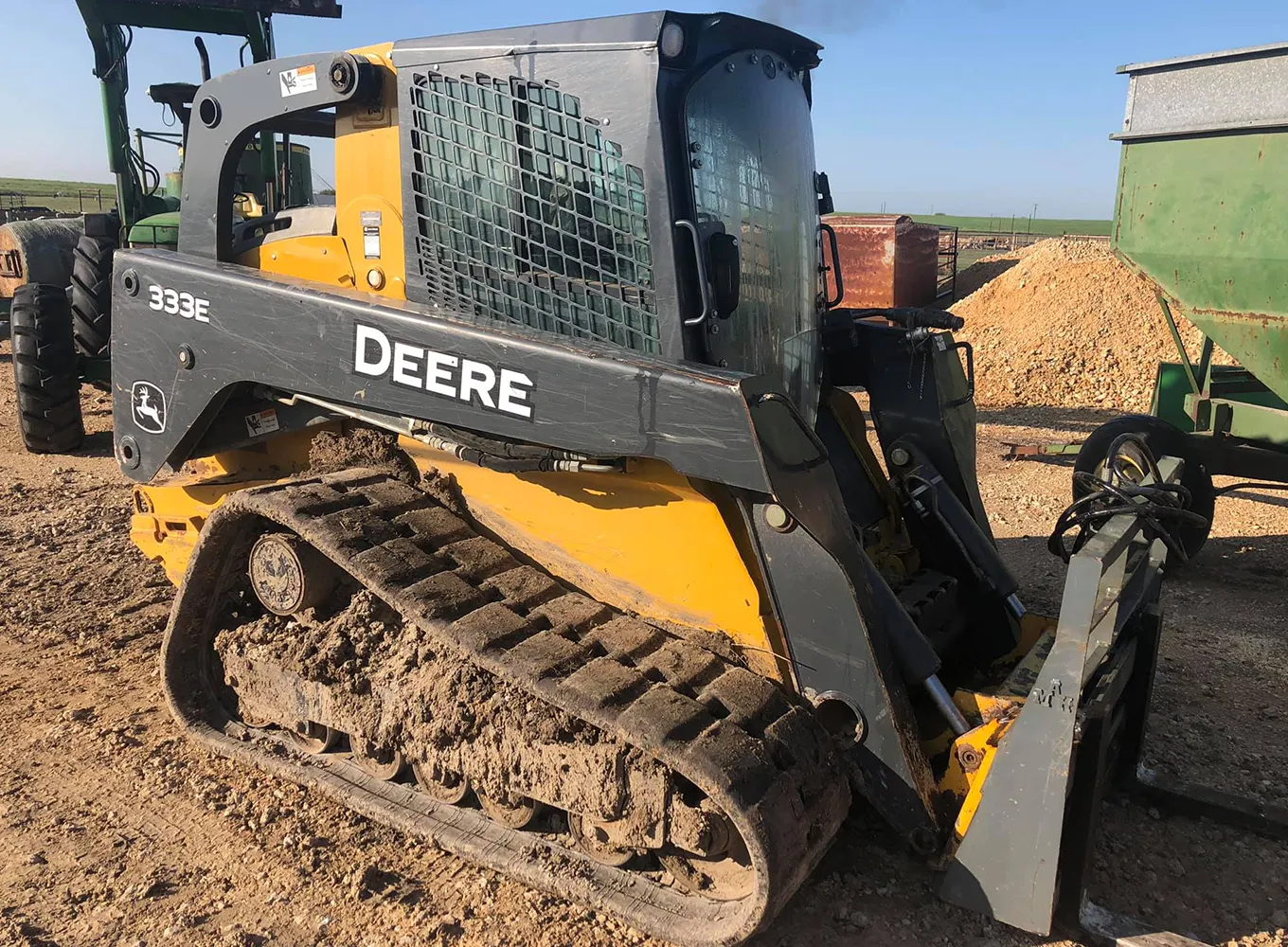 Deere brand forklift with treads, rubber tracks in central illinois